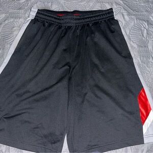 Black, red, and white Nike Dri fit shorts